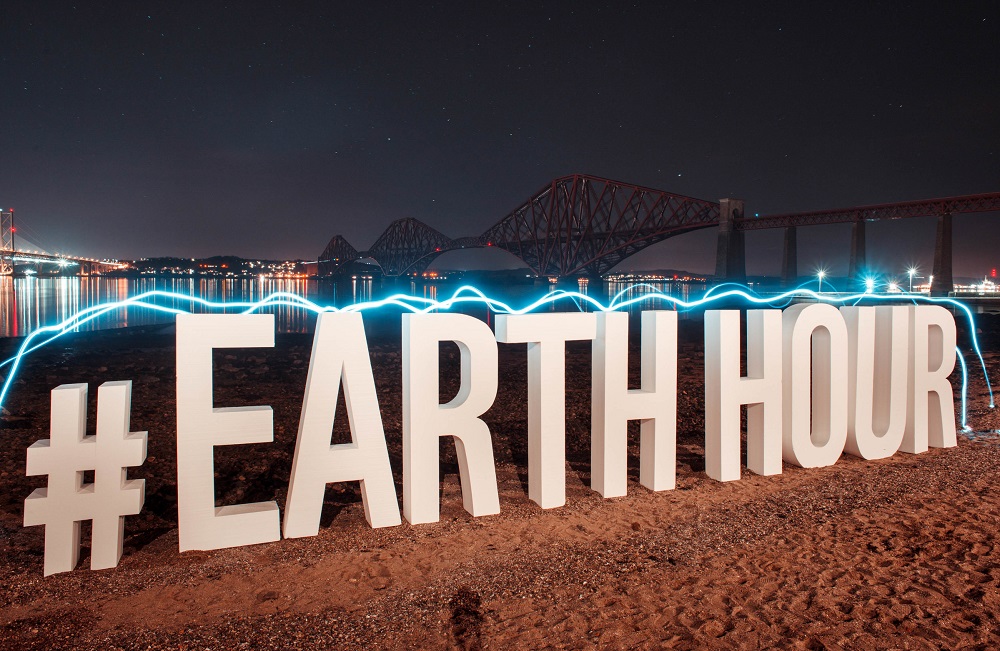 Earth Hour 2017 celebrations in UK   QUEENSFERRY, UK - 25th March 2017: Buildings across Scotland participate in WWF's Earth Hour on March 25, 2017. Countries across the world signed up to participate in turning off lights for 60 minutes from 8:30 to 9:30 in the evening local time in an effort to raise global awareness on climate change. The campaigns goal is to get over 1 billion people switching off their lights as part of a global vote against climate change.  Pictured giant letters are erected at the Forth Rail Bridge in Queensferry as the iconic bridge goes dark for Earth Hour.